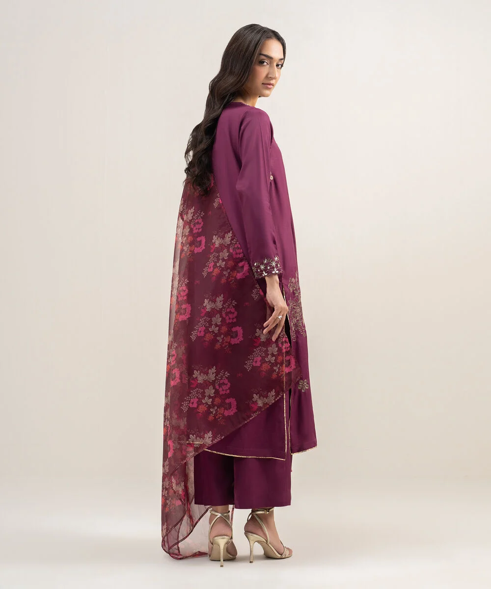 Back design of plum formal suit for women